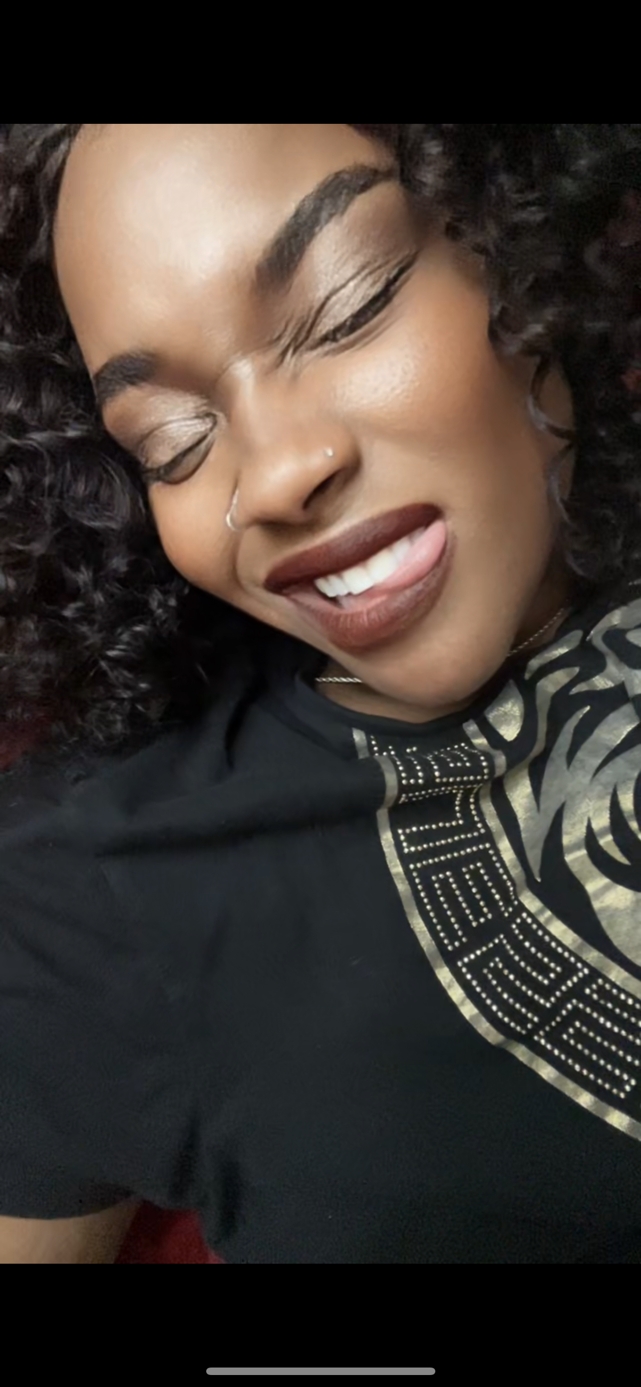 MIAMOR smiling curly hair dark outfit